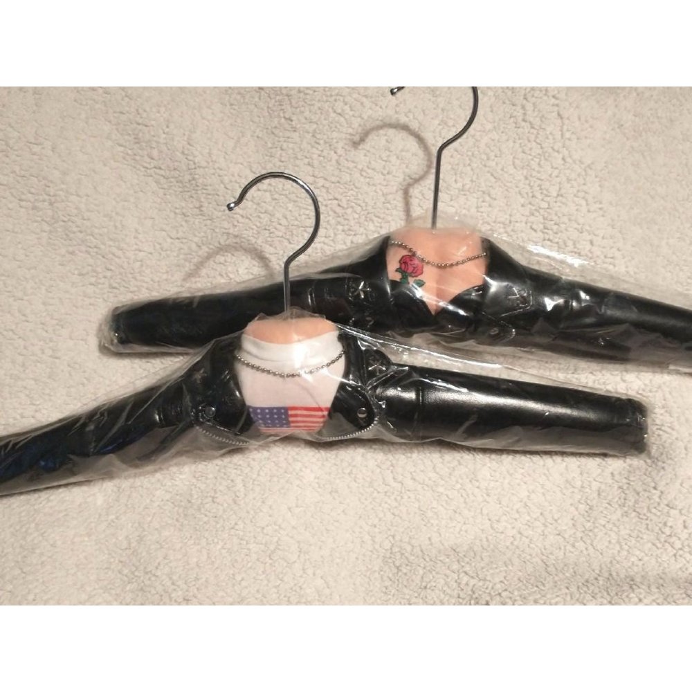(2) New in plastic 'Biker' hangers. Heavy duty, decorated clothes hangers